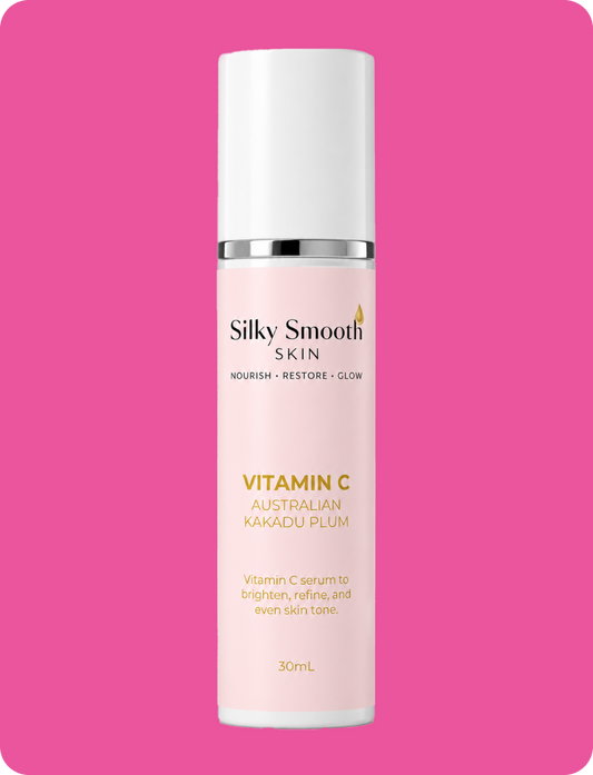 Silky Smooth Skin Vitamin C Australian Kakadu Plum serum in a white pump bottle on a pink background.