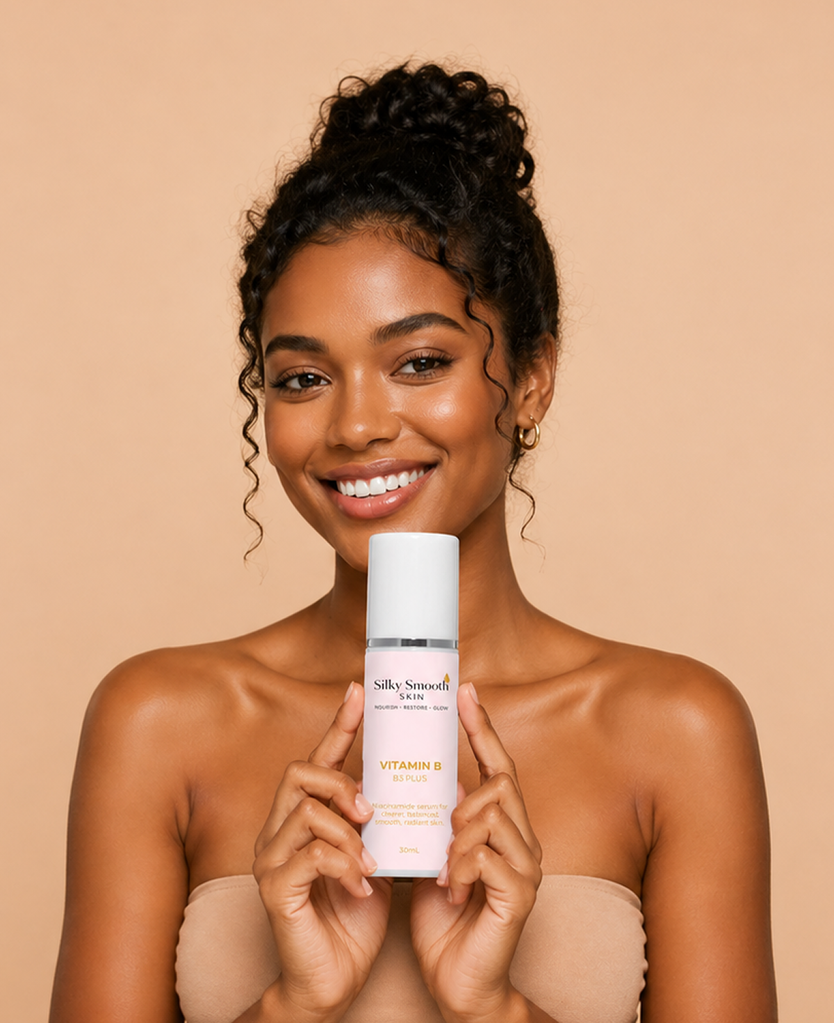 Smiling woman holds Silky Smooth Skin Vitamin B serum against a beige background, highlighting skincare and beauty